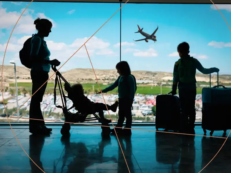 Engineering Safety and Precision for Critical Applications 1 Mother with children at airport window - Astec Precision engineering safety blog feature